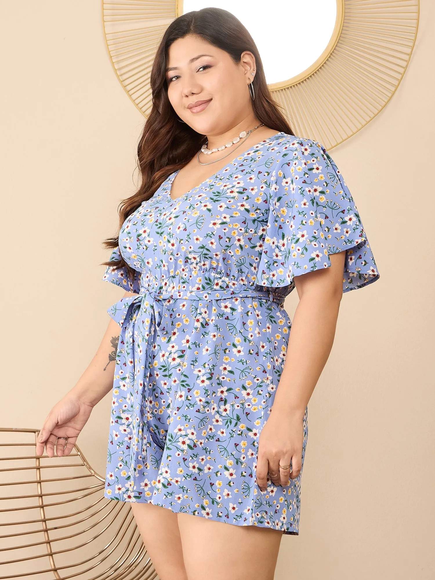 Berrylush Curve Women Blue & White Floral Printed V-Neck Flared Sleeves Tie-Up Waist Back Keyhole Straight Hem Mini Jumpsuit