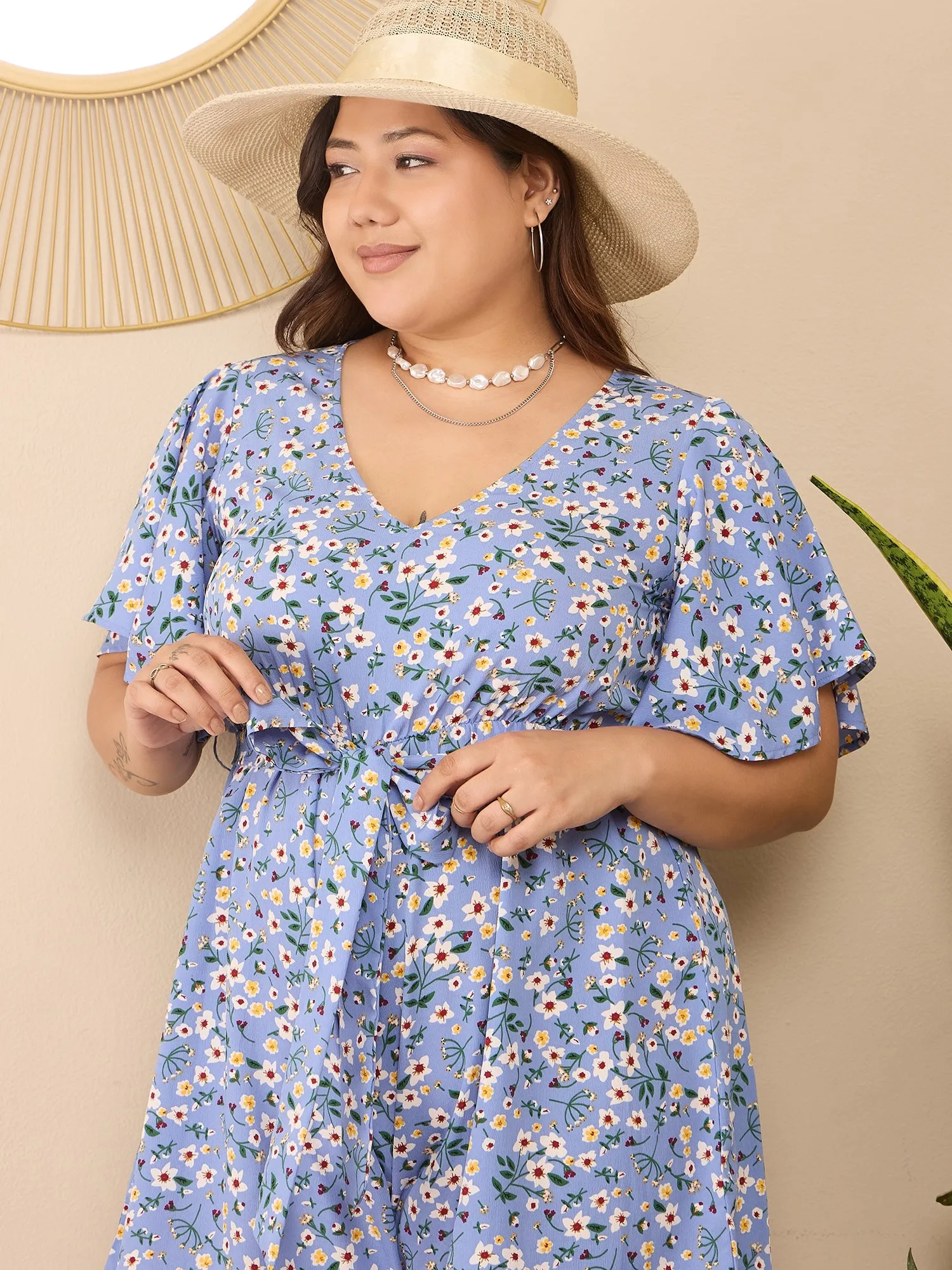 Berrylush Curve Women Blue & White Floral Printed V-Neck Flared Sleeves Tie-Up Waist Back Keyhole Straight Hem Mini Jumpsuit